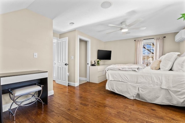 bedroom featuring vaulted ceiling, a wall unit AC, ceiling fan, and dark hardwood / wood-style flooring