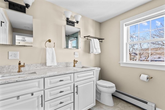 bathroom featuring vanity, a baseboard radiator, toilet, and plenty of natural light