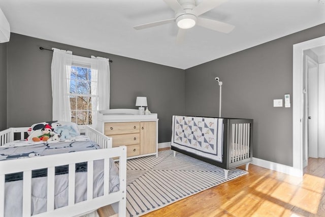 bedroom featuring wood-type flooring and ceiling fan