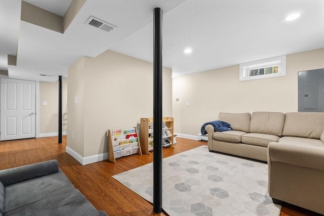 living room featuring hardwood / wood-style floors and electric panel