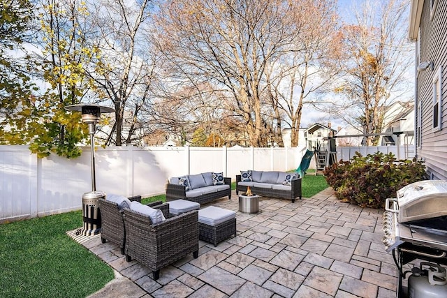 view of patio featuring grilling area, a playground, and outdoor lounge area