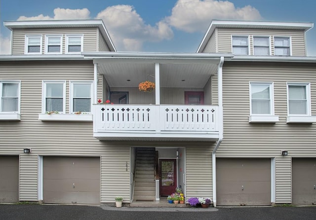 500 W St Unit 6, Amherst, MA 01002 - view of property featuring a balcony and an attached garage