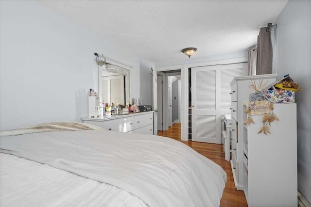 bedroom with a closet and light wood-type flooring