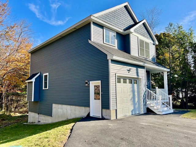 view of front of house with a front yard and a garage