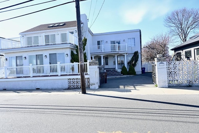 view of front of home with a balcony