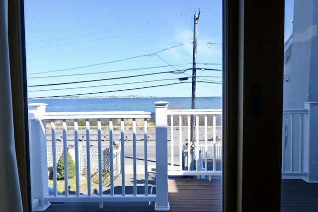 balcony featuring a water view