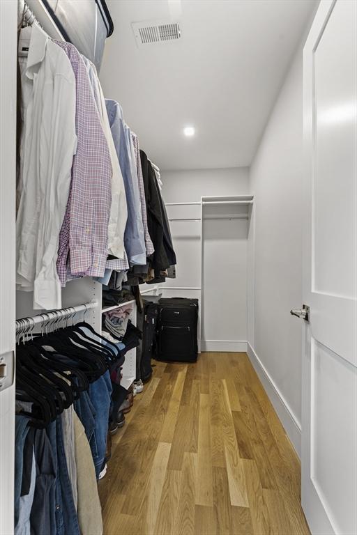 spacious closet with light wood finished floors