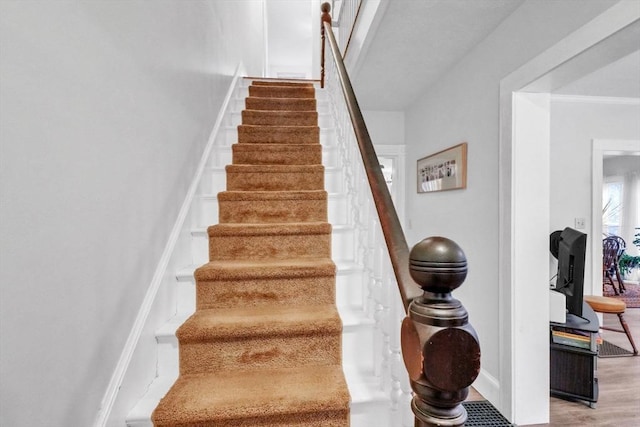 staircase featuring hardwood / wood-style flooring