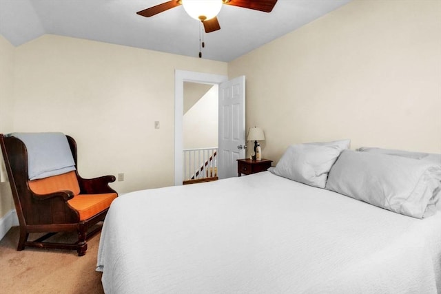 carpeted bedroom featuring vaulted ceiling and ceiling fan