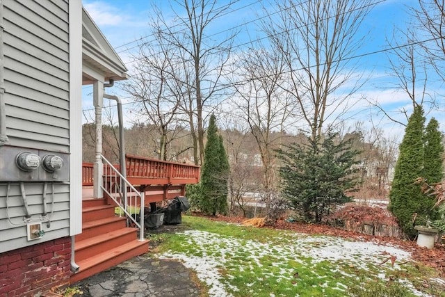 view of yard featuring a wooden deck