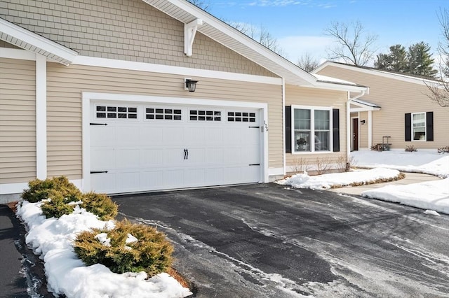 exterior space featuring driveway and an attached garage