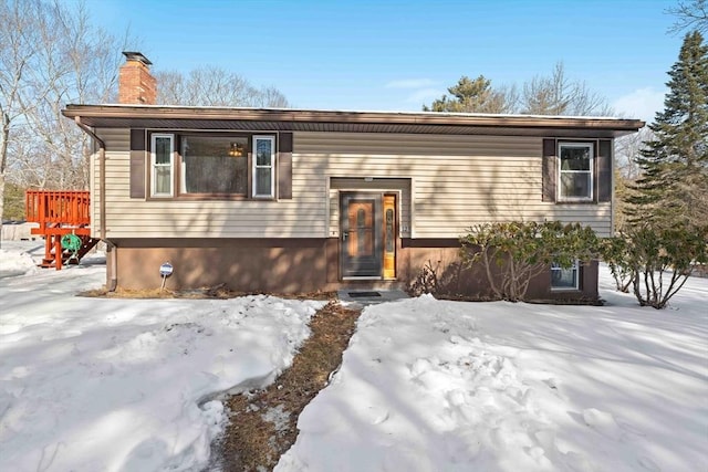 bi-level home featuring a chimney