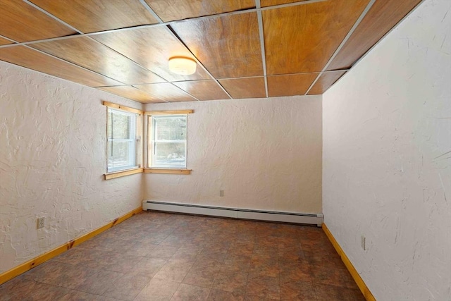 unfurnished room featuring a baseboard radiator, wooden ceiling, a textured wall, and baseboards