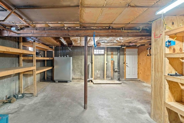 basement featuring freestanding refrigerator