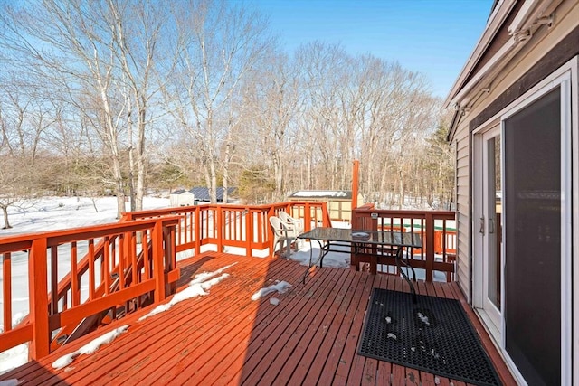 view of snow covered deck