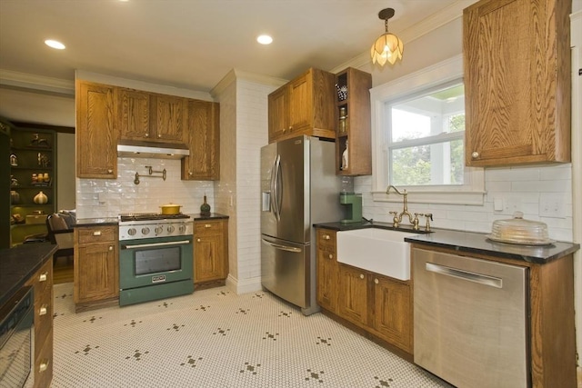 104 Longmeadow St, Longmeadow, MA 01106 - kitchen featuring appliances with stainless steel finishes, dark countertops, under cabinet range hood, brown cabinetry, and ornamental molding