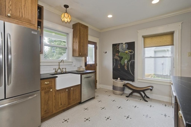 104 Longmeadow St, Longmeadow, MA 01106 - kitchen with stainless steel appliances, dark countertops, brown cabinets, recessed lighting, and ornamental molding