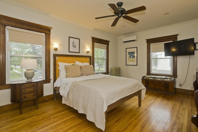 104 Longmeadow St, Longmeadow, MA 01106 - bedroom featuring a wall unit AC, hardwood / wood-style floors, radiator, ornamental molding, and ceiling fan