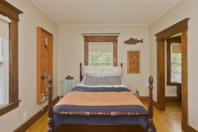 104 Longmeadow St, Longmeadow, MA 01106 - bedroom with light wood-type flooring, radiator heating unit, and ornamental molding