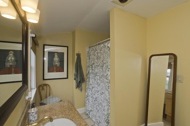 104 Longmeadow St, Longmeadow, MA 01106 - full bathroom with vanity, lofted ceiling, and a shower with shower curtain