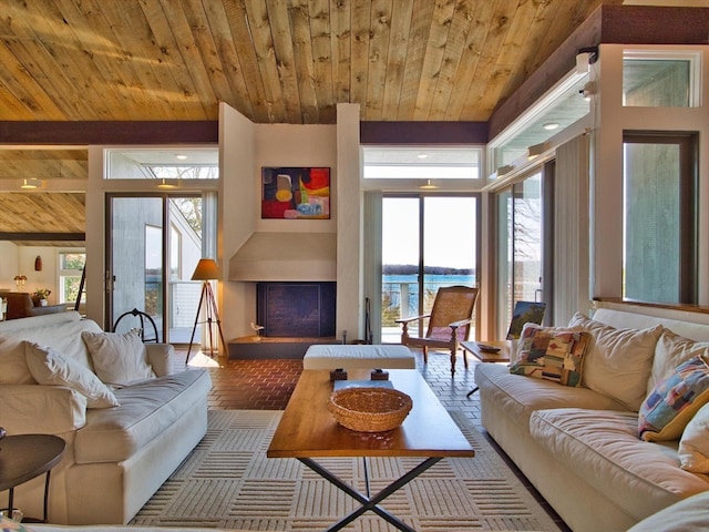 living room with wooden ceiling and a water view