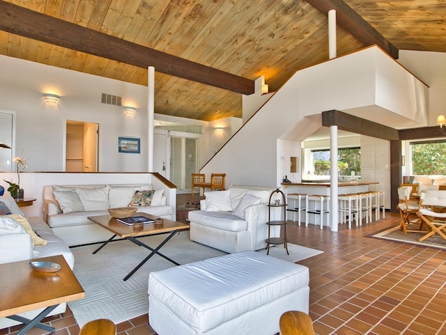 tiled living room with beamed ceiling, high vaulted ceiling, and wood ceiling