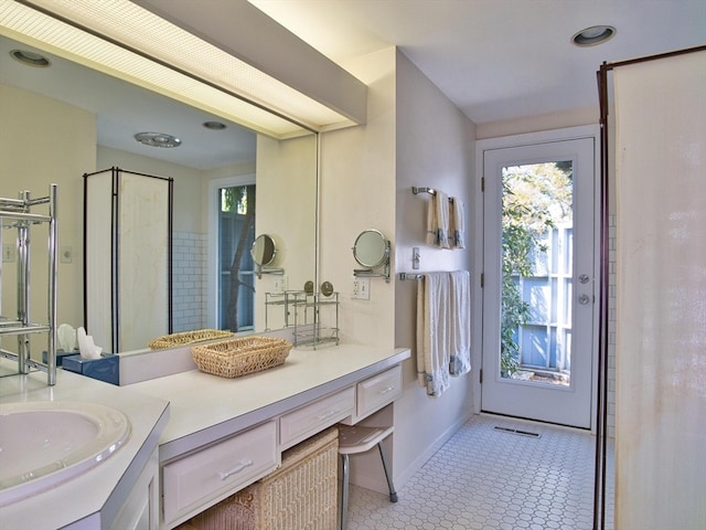 bathroom with tile floors and vanity