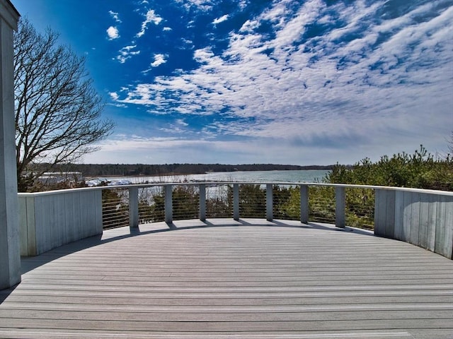 deck featuring a water view