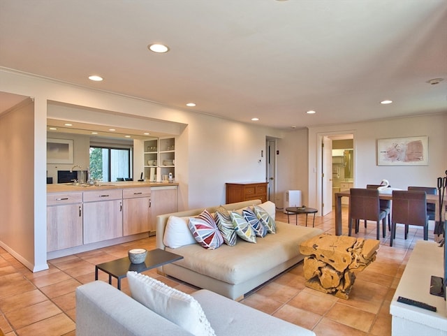 living room with built in shelves and light tile flooring