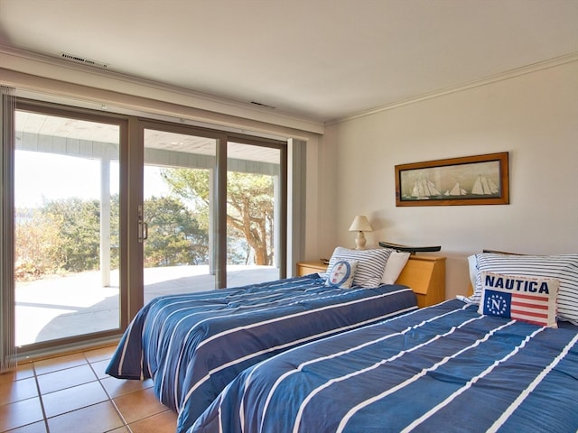 bedroom with tile floors and access to exterior