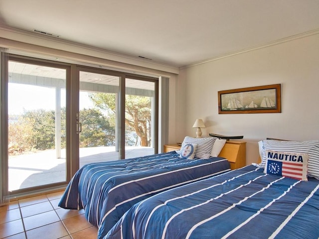 bedroom featuring access to exterior, tile patterned floors, and crown molding