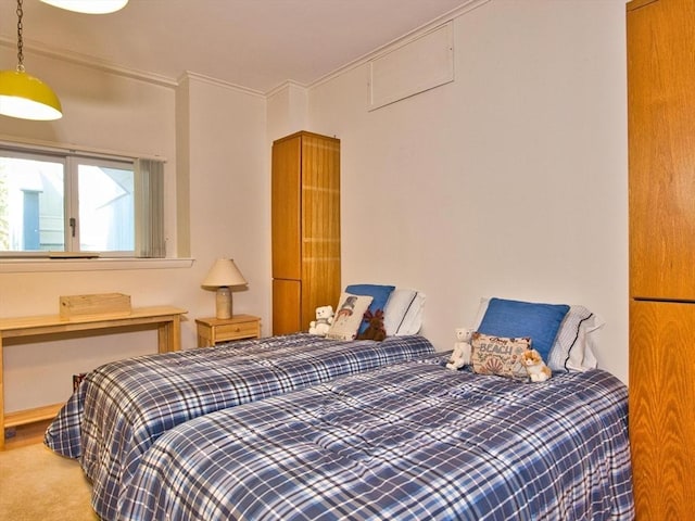 carpeted bedroom featuring crown molding
