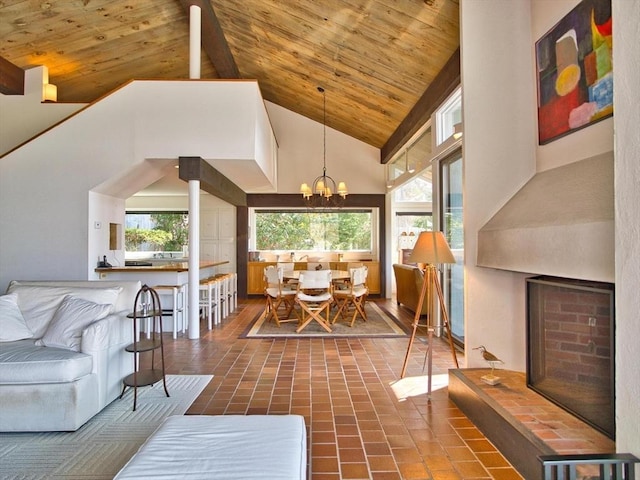 living area featuring wooden ceiling, high vaulted ceiling, beamed ceiling, and a chandelier