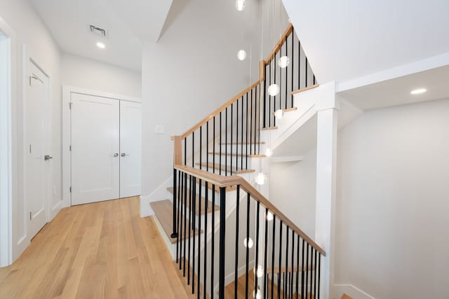 corridor with light hardwood / wood-style flooring