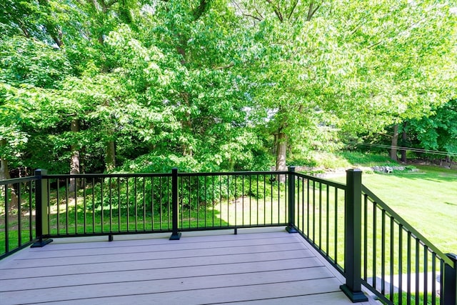 deck featuring a lawn