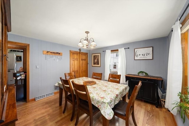 34 Robert Bigelow St, Chelmsford, MA 01824 - dining space featuring a chandelier, light wood-type flooring, and baseboards