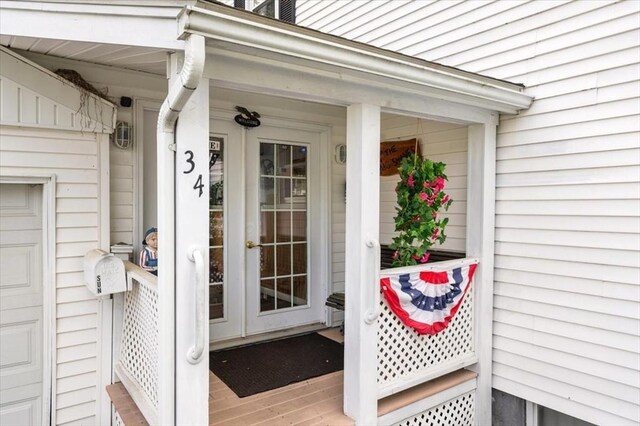 34 Robert Bigelow St, Chelmsford, MA 01824 - property entrance featuring french doors