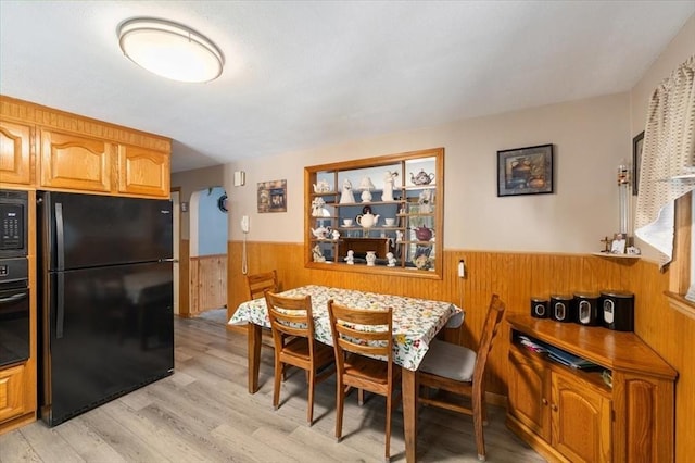 34 Robert Bigelow St, Chelmsford, MA 01824 - dining room with a wainscoted wall, wood walls, light wood finished floors, and arched walkways