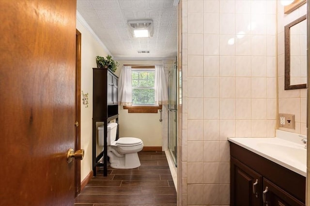 34 Robert Bigelow St, Chelmsford, MA 01824 - bathroom featuring toilet, a shower stall, crown molding, wood finished floors, and vanity