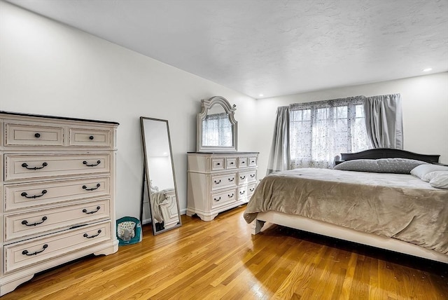 bedroom with light wood-type flooring