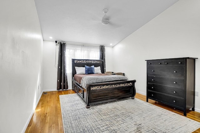 bedroom featuring ceiling fan and light hardwood / wood-style flooring