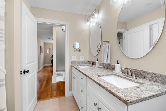 bathroom with tile patterned flooring and vanity