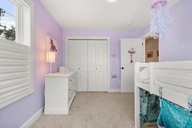 carpeted bedroom featuring a closet