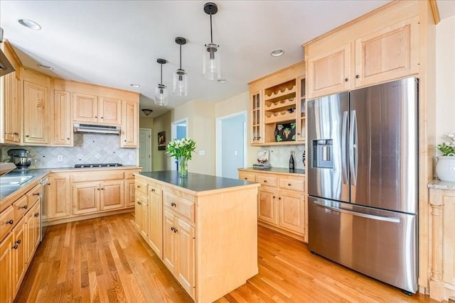 kitchen featuring stainless steel appliances, light brown cabinets, light wood-style flooring, backsplash, and recessed lighting