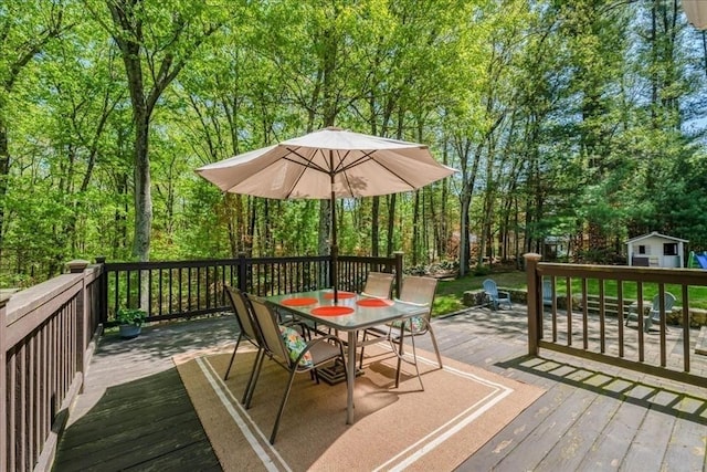 wooden deck with outdoor dining space