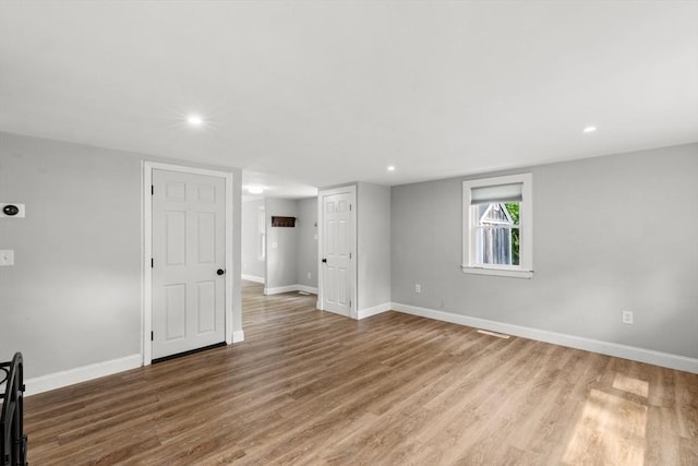 42 Deer Hollow Rd, Sandwich, MA 02644 - unfurnished living room featuring wood finished floors and recessed lighting