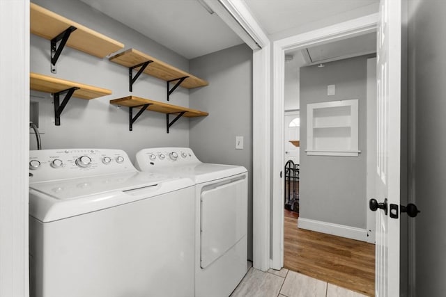 42 Deer Hollow Rd, Sandwich, MA 02644 - laundry area featuring attic access, washer and clothes dryer, and light wood-type flooring