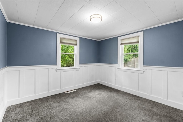 42 Deer Hollow Rd, Sandwich, MA 02644 - spare room featuring dark colored carpet, wainscoting, and crown molding