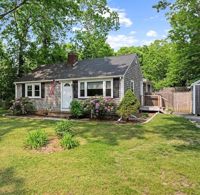 42 Deer Hollow Rd, Sandwich, MA 02644 - view of front facade with a chimney and a shingled roof