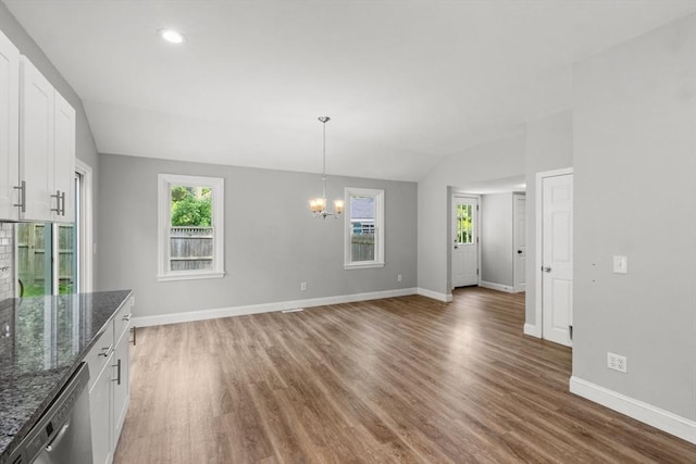 42 Deer Hollow Rd, Sandwich, MA 02644 - unfurnished dining area with vaulted ceiling, a chandelier, light wood-type flooring, and recessed lighting